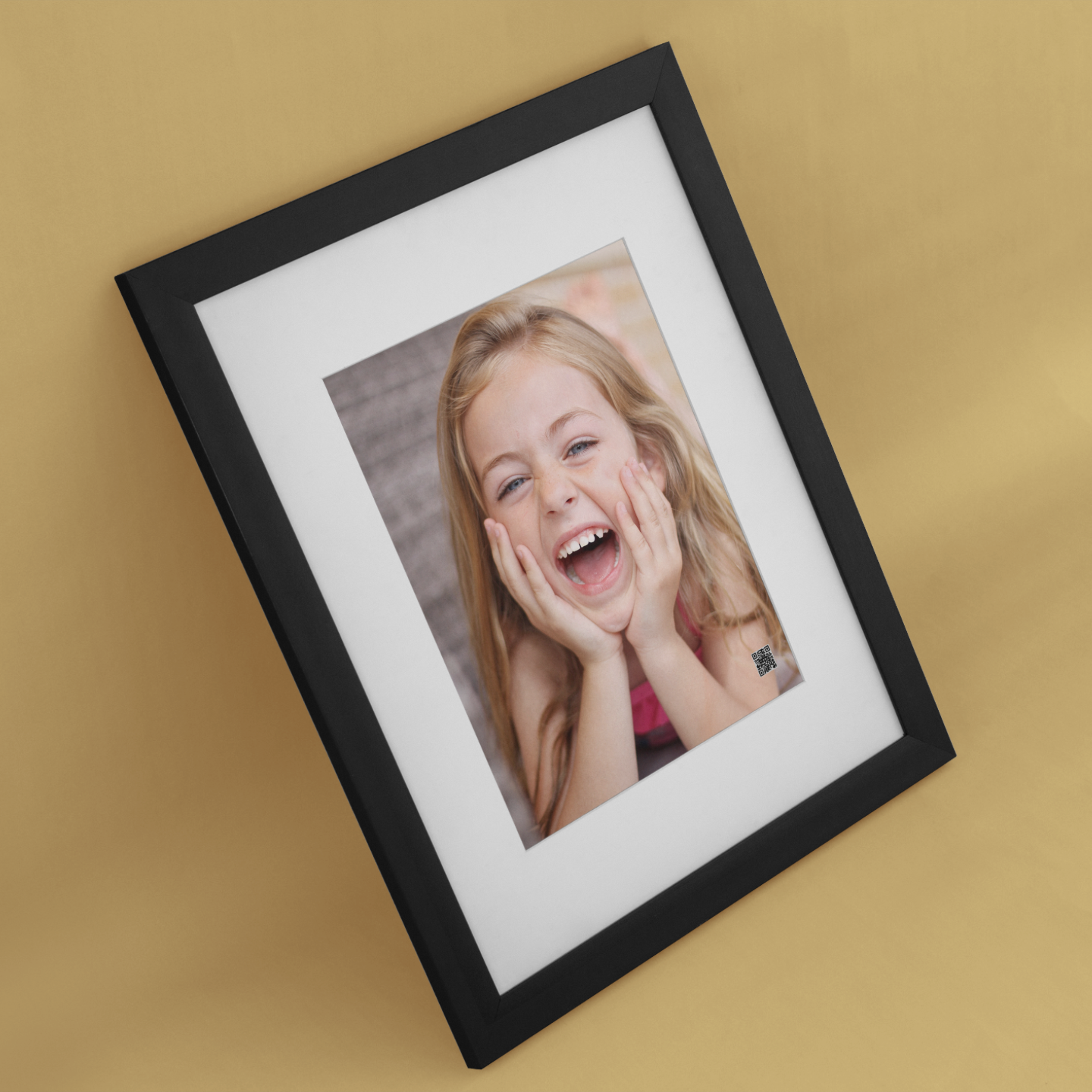 Framed photo of a person laughing on a beige background with personalized voice message.