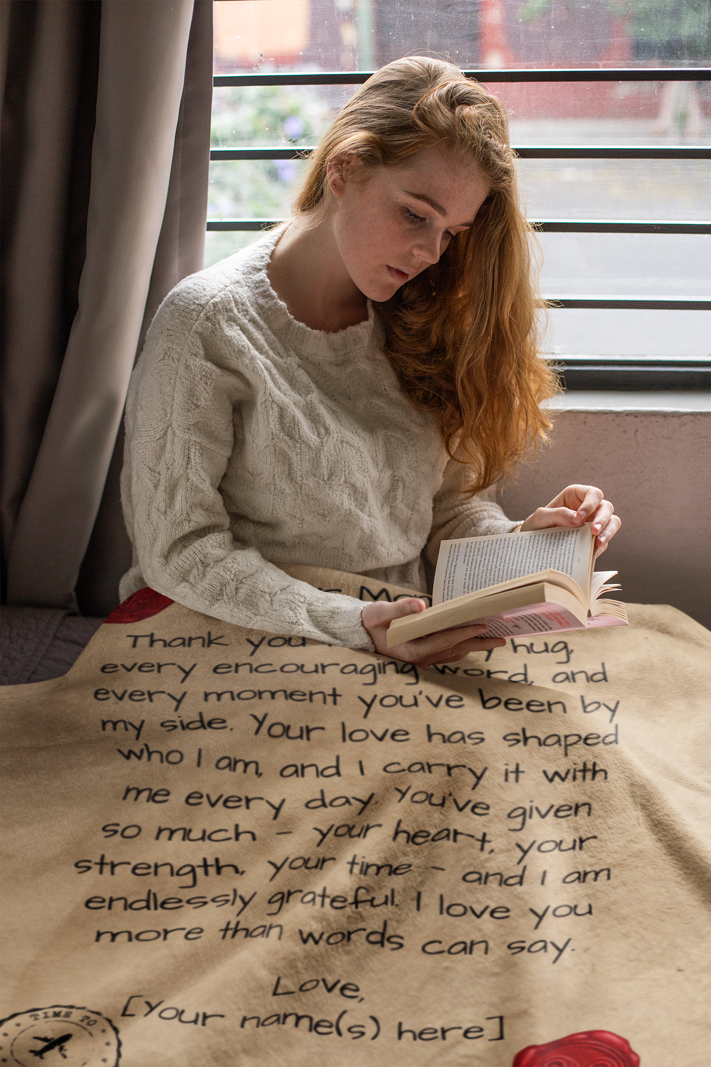 Personalized Letter to Mom light beige Blanket with bold red seal pictured with a woman reading a book. 